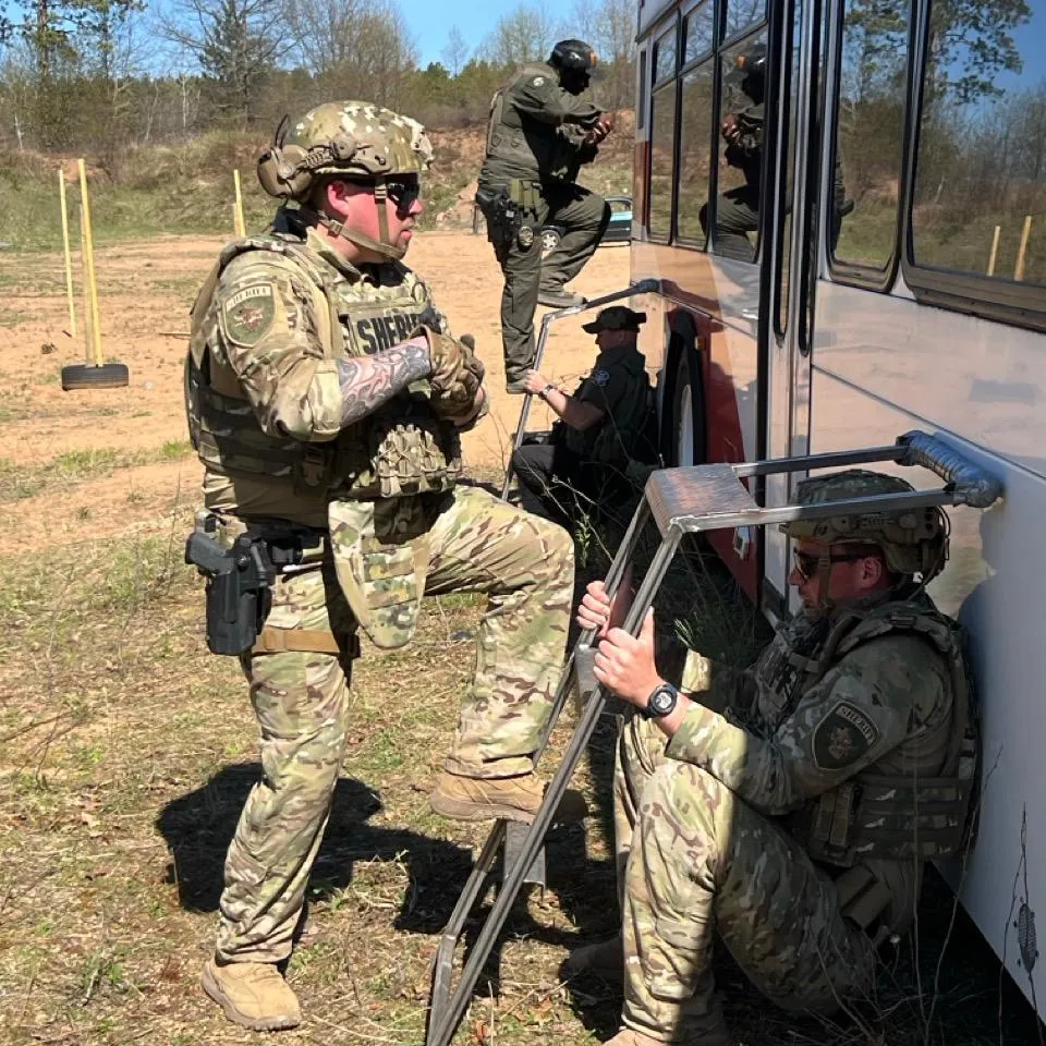 Multiple officers training outside.